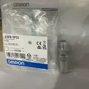 Omron E3FB-DP22 photoelectric sensor — top label close-up showing model code and 300mm sensing distance