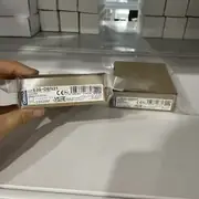 Omron E3S-DBN21 retro-reflective transparent-target sensor — side view showing the M12 4-pin metal connector at the back and the cable-exit direction indicator showing 90° cable orientation