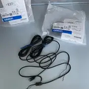 E3T-ST11 2M box label showing the 1 m range, NPN open-collector output, 12-24 VDC supply, and the 2 m pre-wired cable marking