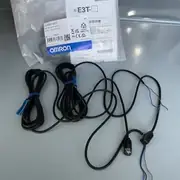 E3T-ST11 2M emitter and receiver removed from the box, side by side, showing the ultra-thin 20 x 12 x 31 mm ABS heads and the 2 m pre-wired leads