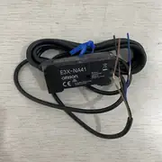 Omron E3X-NA41 2M fiber amplifier — top label close-up showing Light-ON / Dark-ON mode switch and model code