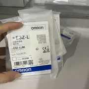 Omron E3Z-LL86 — top label close-up showing the part number, the 12-24 VDC rating, the IP67 mark, and the laser class 1 warning on the housing