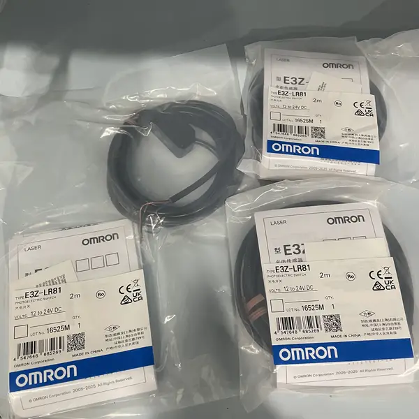 Omron E3Z-LR81 — front face of the compact PBT housing showing the laser emitter window, the receiver lens, and the indicator LEDs