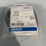 Omron E3Z-LR81 — rear face showing the Light-ON / Dark-ON selector switch, the sensitivity adjuster, and the 2 m pre-wired cable gland