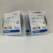 Omron E3Z-LS61 — pair of anti-static sealed bags on a white surface, both with the E3Z-LS61 PHOTOELECTRIC SWITCH label, OMRON Corporation mark, and MADE IN CHINA stamp
