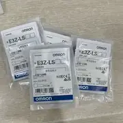 Omron E3Z-LS66 — rear face showing the 5-turn endless sensitivity potentiometer, the Light-ON / Dark-ON selector switch, and the M8 4-pin male connector on the back of the housing