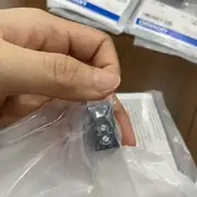 Omron E3Z-R86 — top label close-up showing the part number, the MSR feature, and the IP67 rating on the cuboid PBT housing