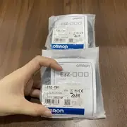 Omron E3Z-T81 through-beam sensor — receiver front face with infrared LED window and operation indicator