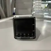 Omron E5CC-QX2ASM-802 — top label close-up showing the part number, the AC supply rating, and the 5.2 VA consumption marking