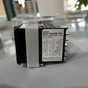 Omron E5CC-RX2ASM-802 48x48 mm digital PID temperature controller in front view, showing the white PV LCD, the four front buttons (mode / set / up / down), and the front face label