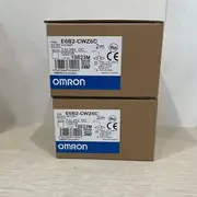 Omron E6B2-CWZ6C — rear view showing the cable exit, the cable gland, and the mounting flange with four bolt holes on the back of the encoder