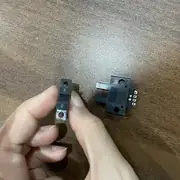 Omron EE-SX670 slot photomicrosensor — emitter/receiver windows visible inside the slot with red operation LED on top