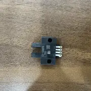 Omron EE-SX670 slot photomicrosensor — mounting hole pattern 2 × 2.3 mm on 15 mm centres for bracket fixation