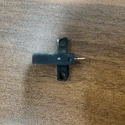 Omron EE-SX672 slot sensor — top-down view showing the T-shaped body with two round mounting holes and the narrow 5 mm sensing slot between emitter and receiver