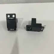 Omron EE-SX674 slot photomicrosensor — side profile showing the close-mounting body with the slot set back 10 mm from the front face and the PCB pins protruding from the rear of the housing