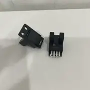 Omron EE-SX674 slot photomicrosensor — close-up of the EE-1006 connector end showing the 4-pin socket and the four colour-coded wires (brown +V, blue 0V, black OUT, pink L-terminal)