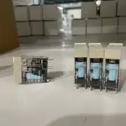 Omron G2R-2-SND DC24(S) — installed on a P2RF-08-E DIN-rail octal socket with the 24 VDC coil wiring from a PLC output on one side and the AC load wiring on the other