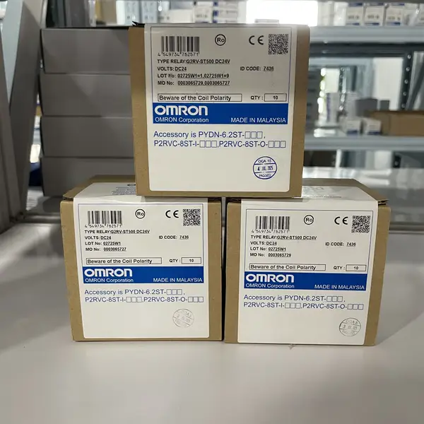 Omron G2RV-ST500 DC24 slim relay — three retail boxes stacked showing Omron label TYPE RELAY:G2RV-ST500 DC24V, VOLTS:DC24, QTY 10, OMRON Corporation, Made in Malaysia, with Beware of the Coil Polarity notice
