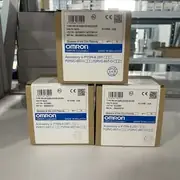 Omron G2RV-ST500 DC24 slim relay — three retail boxes stacked showing Omron label TYPE RELAY:G2RV-ST500 DC24V, VOLTS:DC24, QTY 10, OMRON Corporation, Made in Malaysia, with Beware of the Coil Polarity notice