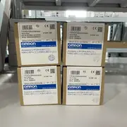 Omron G2RV-ST500 DC24 slim relay — two stacked retail boxes with Omron DC24 type label, accessory line showing P2RVC-8ST-I and P2RVC-8ST-O bridge compatibility on white warehouse shelving