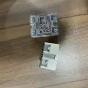 Omron G3NB-225B-1 — front view of the solid state relay showing the operation LED, the input terminals, the output terminals, and the protective cover over the contact screws
