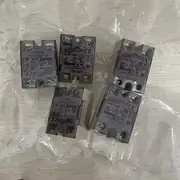 Omron G3NB-225B-1 — side view showing the relay body, the heat sink mounting holes, and the varistor indicator on the side of the housing
