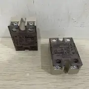 Omron G3NB-225B-1 — top label close-up showing the part number, the 25 A load current, the AC24-220 V rating, and the DC5-24 V input marking on the housing