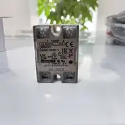 Omron G3NB-240B-1 DC5-24V 40 A solid-state relay — front view showing the screw terminal block (4 terminals: M4 AC load T1/T2 + M3.5 DC control +/-) and the input LED indicator on the top face