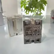 Omron G3NB-240B-1 DC5-24V SSR — top view showing the model-number label with 'G3NB-240B-1 DC5-24V' designation, UL/CSA/TÜV certification marks, and the wiring diagram stamped on the housing top
