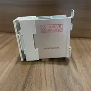Omron G3PA-220B-VD-X DC5-24V solid state relay — rear view showing the integrated aluminium heatsink fins with the VDE finger-safe terminal cover installed