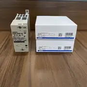 Omron G3PA-220B-VD-X DC5-24V solid state relay — installed on a 35 mm DIN rail in a control cabinet next to a temperature controller, with the AC heater load wired to the output terminals and the DC control signal wired to the input terminals