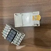 Omron G6B-4BND DC24V terminal relay — two complete G6B-4 terminal relay blocks side by side showing the plug-in G6B relays with OMRON branding and the grey Phillips screw terminal bases with yellow/white wire entry markings