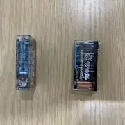 Omron G7SA-5A1B DC24 safety relay — transparent relay housing showing the internal mechanism, 14 PCB through-hole pins on the bottom, OMRON G7SA-5A1B 24VDC label on the side