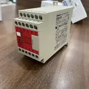 Omron G9SA-501 AC-DC24V compact safety relay in front view, showing the 22.5 mm DIN-rail body, the green PWR LED + red ERR LED on the front face, and the M3.5 screw terminal block across the top and bottom