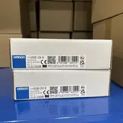 Omron G9SB-200-B AC-DC24V safety relay — close-up of two stacked boxes with detailed Omron labels showing TYPE G9SB-200-B, VOLTS AC/DC24V, QTY 1, LOT 13925M, CE and UKCA certification marks