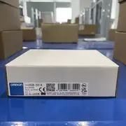 Omron G9SB-200-B AC-DC24V safety relay — single white Omron retail box placed on top of stacked boxes showing TYPE G9SB-200-B label, VOLTS AC/DC24V, QTY 1, OMRON Corporation, MADE IN CHINA