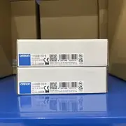 Omron G9SB-200-B AC-DC24V safety relay — two stacked white Omron retail boxes at angle showing reflective surface with clear label visibility of TYPE G9SB-200-B and QTY 1
