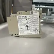 Omron H3DK-M2 AC-DC24-240V multi-function timer — top label close-up showing the model number H3DK-M2, the 8-mode designation, the 24-240 VAC/DC universal supply marking, and the UL / CSA / CE / EN 61812-1 certification marks