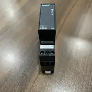 Omron K8DS-PH1 — front view of the 17.5 mm DIN-rail housing showing the green PWR LED, the yellow RY LED, the marking, and the three-phase input terminals on the bottom face