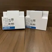 Omron K8DS-PH1 installed on a DIN rail next to a motor contactor with the three phases landed on the input terminals and the SPDT contact wired into the contactor holding circuit