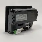 Omron NB3Q-TW01B 3.5-inch TFT HMI - front view showing the 320x240 pixel color LCD display with a sample operator screen, the analog resistive touch panel, the black bezel, and the 4 mounting brackets on the rear