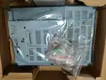 Omron NS15-TX01B-V2 NS-series HMI — side view with mounting brackets for panel cutout installation