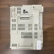 Omron NS8-TV01-V2 NS-series HMI — rear view showing Port A and Port B connectors, ETHERNET socket, HOST USB, SLAVE USB, SW dip switch, RESET button, 24V DC power terminal, made in Japan label, NX<10407 lot number