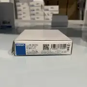 Omron NX-DA2203 NX-series analog output unit — side view showing the slide-rail mounting for NX-ECC EtherCAT coupler attachment and the 12 mm slim form factor typical of NX slice modules
