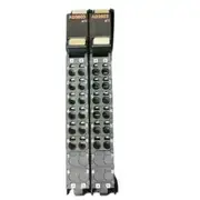Omron NX-AD3603 analog input module — two adjacent units mounted on a NX bus showing the TS status indicator, A/B channel terminal rows, and numbered push-in terminal openings 1 through 8