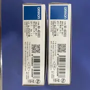 Omron NX-AD3603 analog input module — two Omron-branded retail boxes labelled TYPE NX-AD3603 ANALOG INPUT UNIT, QTY 1, MADE IN CHINA