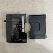 Omron NX-ECC201 EtherCAT coupler — side spec label close-up showing UNIT POWER SOURCE 24V DC 0.75A, UNIT POWER OUTPUT 5.8V DC 10W@40°C, I/O POWER SOURCE 5-24V DC, I/O POWER OUTPUT 5-24V DC 4A, OMRON Corporation Kyodo, Made in China, Ver.1.2, UL listed, NK-APP certification
