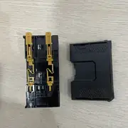 Omron NX-ECC201 EtherCAT coupler — rear view on table showing the gold-finger NX bus connector and the empty slot for end-cover attachment