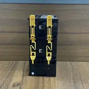 Omron NX-ECC202 EtherCAT coupler — rear view showing two adjacent units mounted with the gold NX bus connector and yellow latches visible on the side