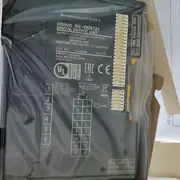 Omron NX-ID5342 NX-series digital input unit — left side showing NX bus connector for stacking next unit